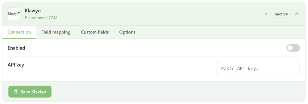 Screenshot of a Klaviyo integration settings page. The integration is marked "Inactive." There are tabs for Connection, Field mapping, Custom fields, and Options. The "Enabled" toggle is off, and there’s a field to paste an API key. A green "Save Klaviyo" button is at the bottom.