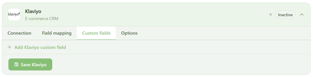 A screenshot of the Klaviyo E-commerce CRM settings page. The "Custom fields" tab is selected. The status is "Inactive." There are options to add a Klaviyo custom field and a green "Save Klaviyo" button at the bottom left.